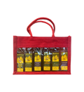 Red jute gift tote with rope handles holding six Kofinas olive oil bottles