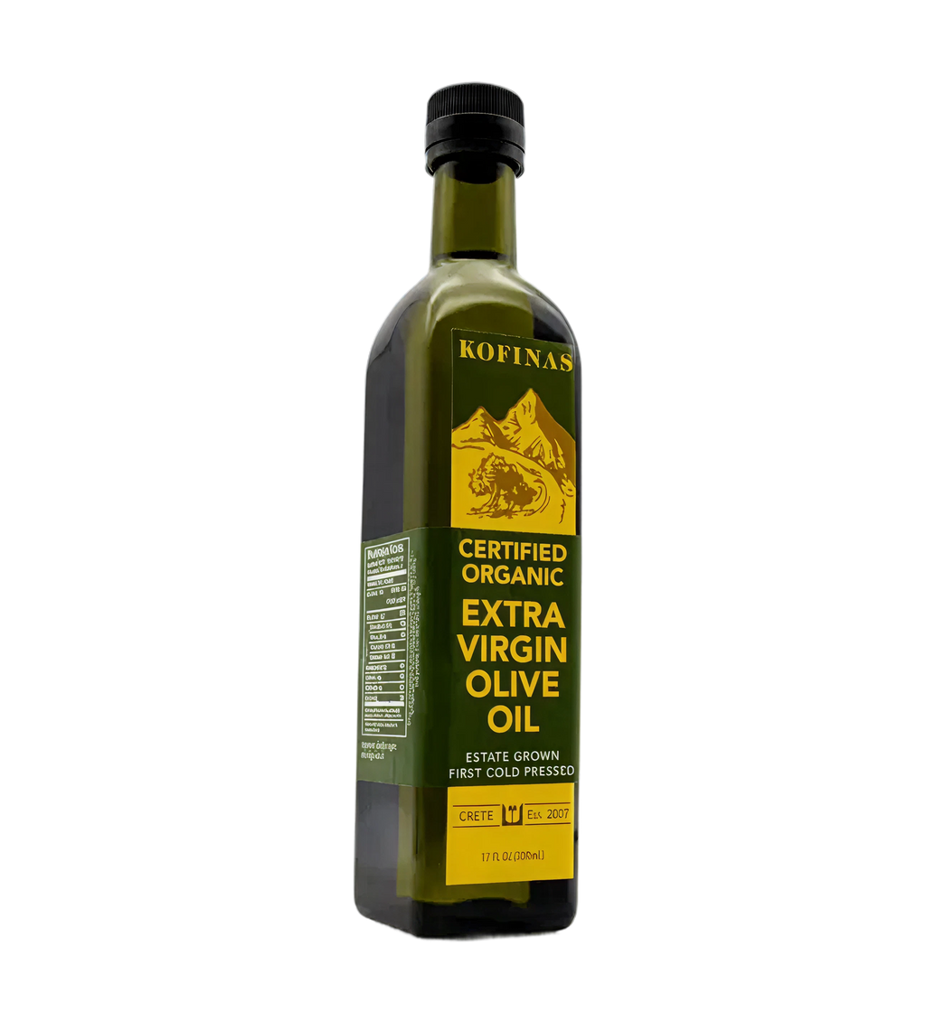 Kofinas Certified Organic extra virgin olive oil in a tall green glass bottle with a gold label