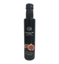 Black bottle of Kofinas Greek balsamic vinegar with fig and a fig label