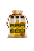 Sheer organza gift bag holding three Kofinas olive oil bottles
