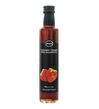 Black bottle of Greek balsamic vinegar with strawberry, with a strawberry on the label