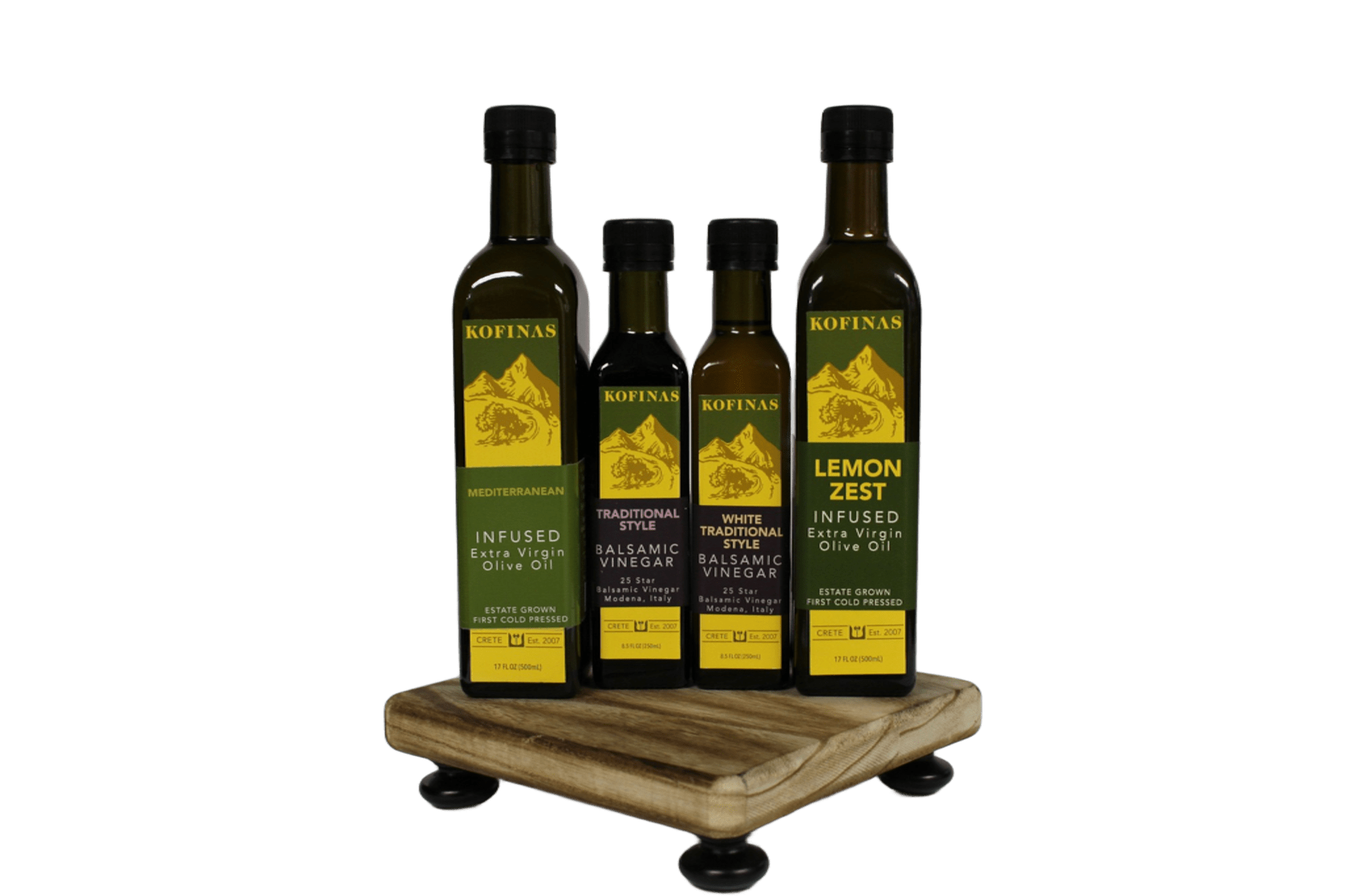 Four Kofinas infused olive oil bottles on a small wooden stand